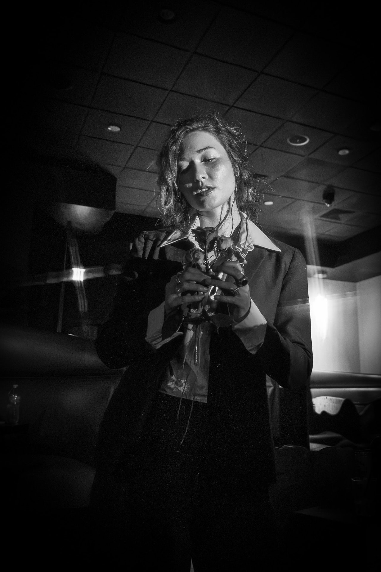 Theatrical performer holding a bouquet of roses